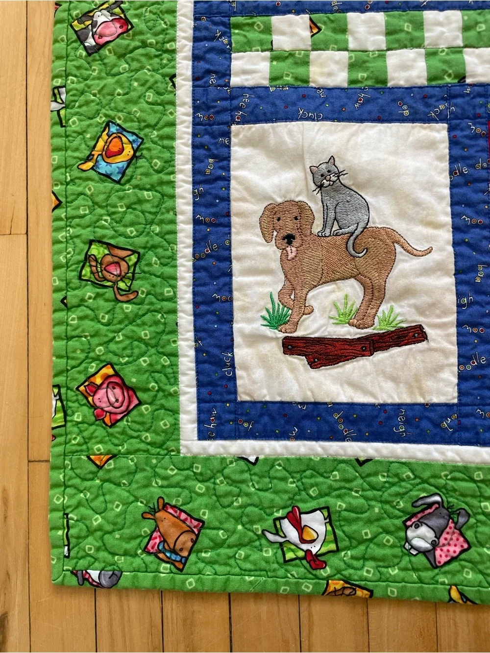 Quack, Moo, Oink quilt with farm animals and 'Quack, Moo, Oink'
